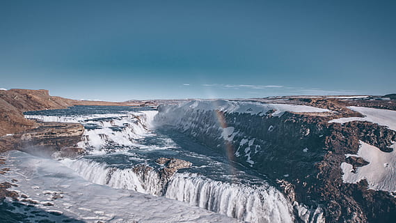waterfall during daytime, mountain, outdoors, nature, ice, snow, glacier, scenery, water, river, landscape, panoramic, plateau, aerial view, wilderness, waterfall, mountain range, crater, volcano, winter, slope, cold temperature, beauty in nature, scenics - nature, environment, frozen, sky, blue, tranquil scene, tranquility, non-urban scene, no people, snowcapped mountain, 5K, CC0, public domain, royalty free