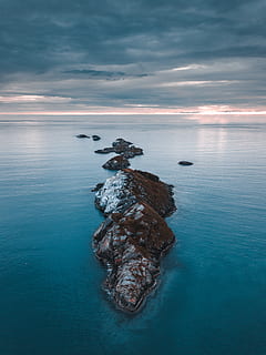 brown island, beach, clouds, dramatic sky, drone, drone photography, drone shot, evening, high angle shot, horizon, norway, ocean, rock formation, scenic, sea, seascape, sky, sunset, water, beauty in nature, scenics - nature, horizon over water, cloud - sky, tranquility, tranquil scene, nature, solid, waterfront, rock - object, rock, idyllic, no people, outdoors, 4K, CC0, public domain, royalty free