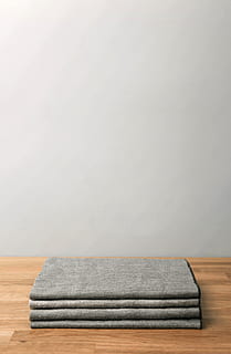 stack, sheets, minimal, wood, table, white, wall, clothes, blanket, shirt, t shirt, indoors, copy space, no people, still life, furniture, textile, single object, wood - material, pillow, gray, wall - building feature, absence, white color, pattern, domestic room, studio shot, flooring, folded, towel, clean, 5K, CC0, public domain, royalty free