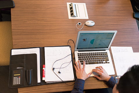 person, blue, dress shirt, facing, white, laptop, brown, wooden, table, desk, earphone, flatlay, folder, furniture, hands, indoors, office, papers, remote work, room, screen, sitting, technology, typing, woman, wood, working, workplace, royalty  images, computer, wireless technology, communication, connection, one person, using laptop, real people, adult, business, hand, human hand, portable information device, computer equipment, keyboard, 5K, CC0, public domain, royalty free