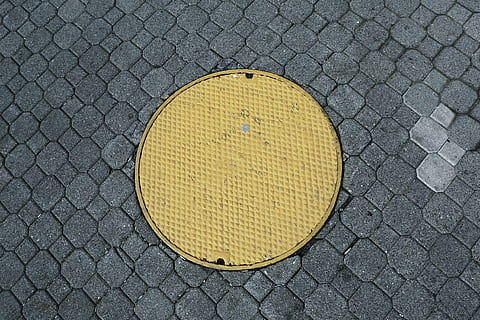 yellow, manhole, cobblestone, pattern, texture, circle, geometric shape, shape, no people, textured, high angle view, design, street, close-up, day, gray, directly above, sign, outdoors, metal, city, sport, symbol, 4K, CC0, public domain, royalty free