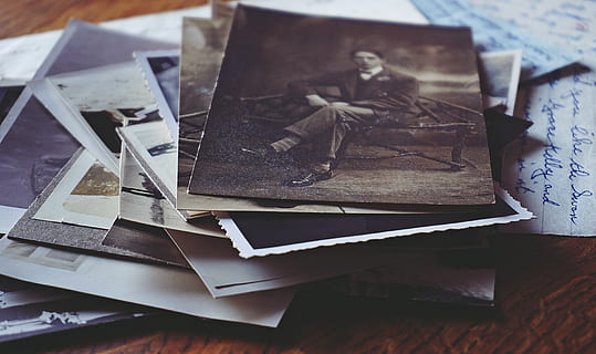 man, sitting, black, chair grayscale photo, classic, close-up, document, law, memories, money, monochrome photography, nostalgia, old letters, old photo, photography, photos, pile, print, still life, vintage, vintage photos, table, paper, indoors, no people, large group of objects, food and drink, food, selective focus, wood - material, high angle view, brown, art and craft, ready-to-eat, stack, publication, sweet food, creativity, temptation, 5K, CC0, public domain, royalty free