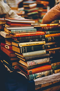 assorted reading books, publication, stack, book, large group of objects, indoors, people, focus on foreground, arrangement, human hand, hand, real people, education, choice, variation, in a row, selective focus, human body part, abundance, collection, order, finger, 5K, CC0, public domain, royalty free