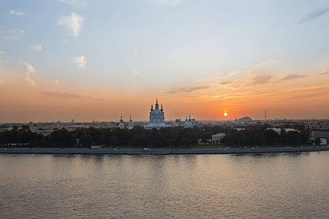 sunset, river, landscape, clouds, lake, city, church, cathedral, sky, architecture, built structure, water, building exterior, waterfront, no people, orange color, building, nature, cloud - sky, travel destinations, outdoors, travel, tower, 5K, CC0, public domain, royalty free