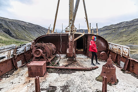 person, standing, abandoned, ship, daylight, decaying, environment, grass, ice, jacket, landscape, man, mountains, nature, nature photography, outdoors, photography, rust, rusty, scenic, ship wreck, snow, transportation system, transportation, mode of transportation, mountain, sky, day, scenics - nature, winter, land, cold temperature, clothing, people, metal, real people, water, red, warm clothing, 2K, CC0, public domain, royalty free