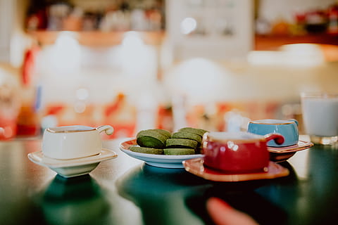 coffee, green, tea cookies, books, red, food and drink, table, cup, drink, food, mug, plate, indoors, crockery, refreshment, saucer, coffee cup, healthy eating, selective focus, no people, freshness, restaurant, wellbeing, coffee - drink, tea cup, glass, meal, setting, breakfast, 5K, CC0, public domain, royalty free