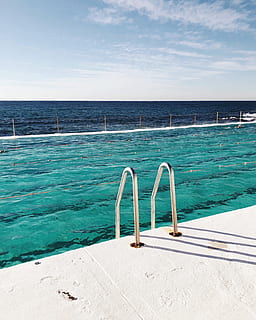 gray pool ladder, water, sky, swimming pool, pool, nature, horizon, sea, blue, horizon over water, day, sunlight, no people, scenics - nature, beauty in nature, tranquil scene, metal, land, outdoors, tranquility, turquoise colored, 2K, CC0, public domain, royalty free