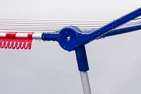 clothes drying rack, plastic, dry, isolated, hang, wash, clothes line, budget, metal, drop of water, raindrop, wet, close up, blue, close-up, connection, red, no people, cable, day, focus on foreground, technology, water, rope, electricity, pipe - tube, single object, white color, outdoors, communication, nature, 5K, CC0, public domain, royalty free