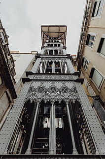 view, historic, elevator, lisbon, portugal, lift, santa justa lift, architecture, built structure, low angle view, building exterior, building, sky, no people, day, city, window, facade, history, the past, travel destinations, nature, architectural column, outdoors, art and craft, travel, tourism, ornate, directly below, 5K, CC0, public domain, royalty free