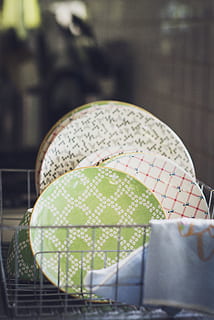 ceramic, plates, rack, focus on foreground, no people, close-up, outdoors, day, protection, pattern, security, selective focus, wet, arts culture and entertainment, seat, white color, art and craft, still life, umbrella, positive emotion, nature, chair, floral pattern, 5K, CC0, public domain, royalty free
