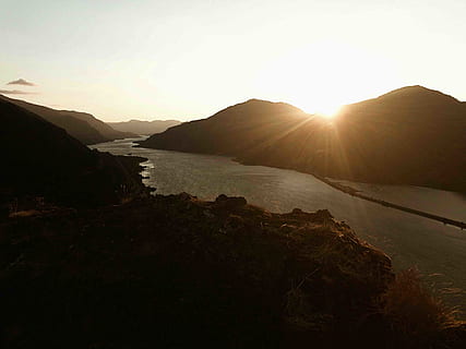 river between mountans, sky, water, nature, mountain, beauty in nature, tranquility, tranquil scene, scenics - nature, sun, sunset, sunlight, no people, rock, lens flare, environment, sunbeam, outdoors, sea, mountain range, 4K, CC0, public domain, royalty free