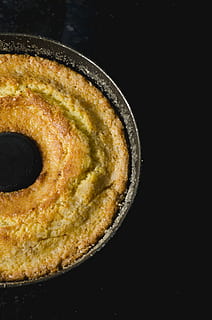 round bread, baking, bread, cake, close-up, delicious, epicure, food, homemade, meal, pastry, sugar, tasty, food and drink, indoors, studio shot, freshness, black background, sweet food, copy space, no people, still life, high angle view, ready-to-eat, dessert, indulgence, unhealthy eating, sweet, baked, temptation, breakfast, 4K, CC0, public domain, royalty free