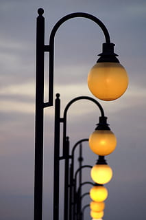lanterns, light, evening, dark, sky, lighting equipment, street light, illuminated, no people, metal, focus on foreground, electricity, street, electric lamp, electric light, close-up, dusk, cloud - sky, yellow, architecture, antique, outdoors, ornate, 5K, CC0, public domain, royalty free