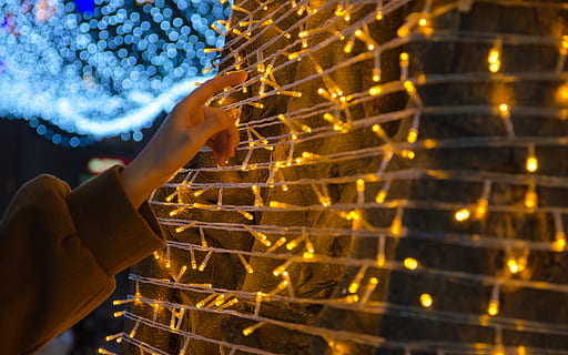 yellow string lihgts, banister, handrail, home decor, person, human, finger, sphere, staircase, light, flare, crystal, female, woman, teen, blonde, girl, kid, child, window, lighting, human hand, human body part, hand, one person, body part, human finger, close-up, holding, industry, technology, nature, adult, selective focus, equipment, indoors, pattern, large group of objects, blue, 4K, CC0, public domain, royalty free