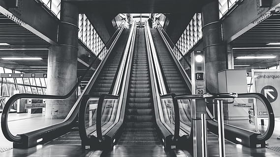 architecture, building, infrastructure, structure, establishment, escalator, stairs, station, black and white, monochrome, transportation, indoors, railing, convenience, public transportation, rail transportation, staircase, technology, direction, steps and staircases, the way forward, modern, built structure, illuminated, subway station, metal, connection, moving walkway, ceiling, 5K