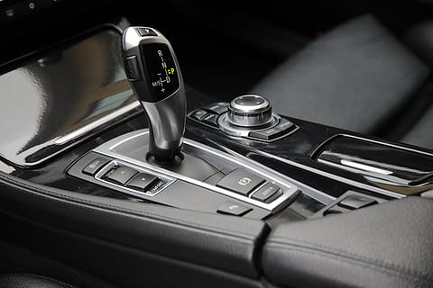 black gear shift, gearshift, gearstick, knob, button, automatic, car, interior, shift, bmw, interior design, decor, console, vehicle, travel, transport, black, dark, buttons, dashboard, no people, close-up, indoors, selective focus, table, still life, technology, control, motor vehicle, medical instrument, high angle view, communication, focus on foreground, transportation, silver colored, metal, mode of transportation, black color, shiny, 5K, CC0, public domain, royalty free