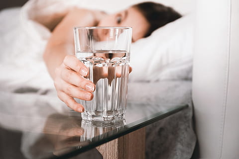 close, woman, holding, glass, water, bed, morning, refreshment, drink, food and drink, drinking glass, one person, household equipment, indoors, adult, human body part, alcohol, hand, drinking, human hand, women, close-up, 5K, CC0, public domain, royalty free