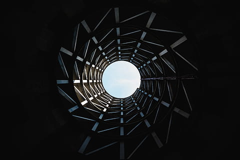 architecture, building, infrastructure, structure, circle, round, clouds, sky, built structure, no people, pattern, geometric shape, directly below, low angle view, shape, indoors, design, nature, repetition, night, diminishing perspective, metal, spiral, railing, black background, ceiling, 5K, CC0, public domain, royalty free