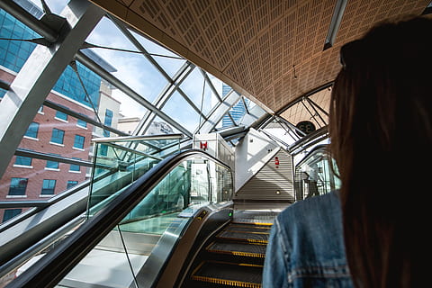 woman, escalators, metro station, architecture, transportation, built structure, one person, city, mode of transportation, indoors, glass - material, escalator, travel, adult, real people, city life, day, lifestyles, modern, motion, connection, 4K