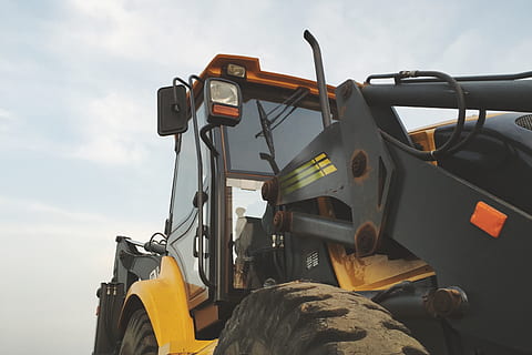 yellow, black, heavy, equipment, blue, sky, bagger, bulldozer, constructing, construction, excavator, transportation, mode of transportation, machinery, land vehicle, nature, no people, day, construction industry, agricultural machinery, construction machinery, outdoors, low angle view, tractor, industry, land, construction equipment, construction site, field, earth mover, wheel, 2K