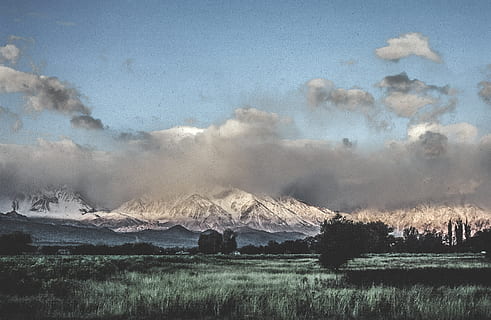 grainy, film, clouds, snow mountain, Blue, Cloud, Cloudy, Covered, Green, Meadow, Park, Sky, Snow, Weather, background, capped, climate, cloud sky, cloudscape, cumulus, day, engulfed, environment, film look, fluffy, forest, nature, outdoor, overcast, season, white, winter, mountain, cloud - sky, landscape, beauty in nature, land, scenics - nature, no people, smoke - physical structure, water, plant, tranquility, geology, non-urban scene, volcano, outdoors, snowcapped mountain, pollution, 2K, CC0, public domain, royalty free