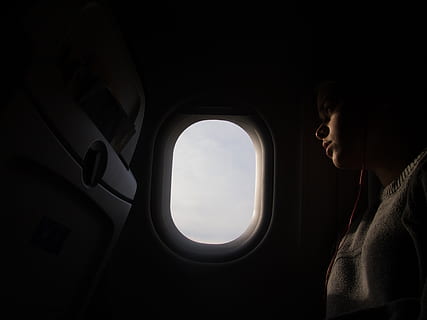 window, dark, inside, airplane, airline, people, girl, travel, trip, flight, one person, mode of transportation, transportation, vehicle interior, looking, journey, air vehicle, sitting, adult, real people, looking through window, lifestyles, side view, nature, mid adult, outdoors, contemplation, 4K, CC0, public domain, royalty free