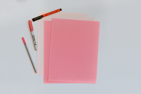 pink printer papers, pen, pencil, copy space, paper, indoors, no people, studio shot, note pad, red, writing instrument, publication, white background, book, blank, close-up, office, still life, reminder, cut out, paperwork, message, 5K, CC0, public domain, royalty free
