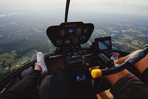 black, helicopter control panel, cockpit, skiatook, united states, reading, foot, panel, helicopter, cock pit, flying, flight, above, fashion, looking down, style, aerial view, travel, transport, windscreen, clothing, footwear, transportation, vehicle interior, mode of transportation, landscape, day, air vehicle, real people, nature, people, glass - material, two people, airplane, pilot, outdoors, technology, environment, 5K, CC0, public domain, royalty free