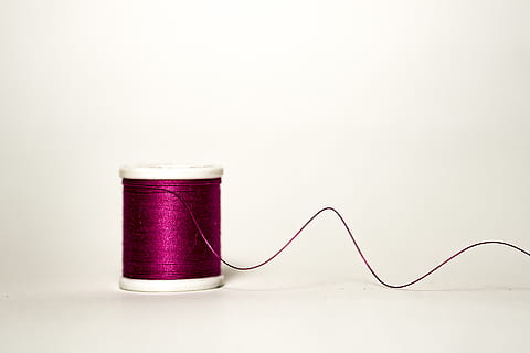 purple thread, thread, studio shot, spool, sewing, indoors, sewing needle, art and craft, sewing item, copy space, textile, needle, creativity, white background, material, still life, purple, wool, multi colored, variation, 5K, CC0, public domain, royalty free
