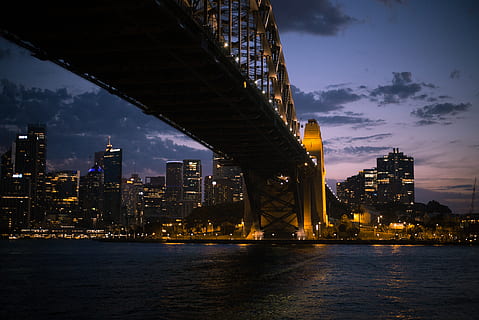 bridge during nighttime, city, building, urban, town, metropolis, water, bridge, office building, outdoors, light, night, waterfront, downtown, architecture, steeple, spire, tower, landscape, structure, evening, built structure, building exterior, sky, illuminated, cloud - sky, river, nature, bridge - man made structure, connection, no people, cityscape, office building exterior, skyscraper, modern, tall - high, financial district, 5K, CC0, public domain, royalty free