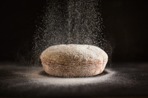 freshly baked bread, baked, bakery, bread, flour, fresh, minimal, minimalistic, simple, simplistic, studio shot, food, indoors, food and drink, close-up, freshness, black background, no people, selective focus, single object, healthy eating, simplicity, preparation, wellbeing, still life, dust, wood - material, exploding, dusting, 5K, CC0, public domain, royalty free