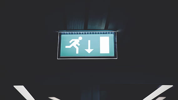 lighted running signage, arrow, control, dark, electronics, fire escape, illuminated, image, lights, sign, signage, symbol, communication, guidance, arrow symbol, representation, directional sign, human representation, no people, indoors, direction, exit sign, information, emergency exit, ceiling, glowing, information sign, close-up, male likeness, information symbol, 4K, CC0, public domain, royalty free
