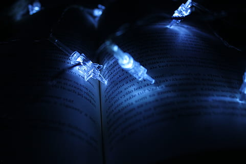 string lights, book, dark, illuminated, light, lights, page, words, paper, close-up, blue, human body part, arts culture and entertainment, selective focus, people, indoors, light - natural phenomenon, night, studio shot, body part, communication, music, text, data, education, high angle view, 2K, CC0, public domain, royalty free