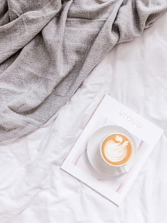 gray textile, coffee, coffee - drink, drink, coffee cup, food and drink, refreshment, mug, cup, indoors, high angle view, still life, one person, midsection, freshness, hot drink, bed, real people, directly above, white color, text, frothy drink, crockery, latte, 4K, CC0, public domain, royalty free