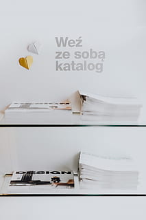 stack, design magazines, newspapers, magazine, design, catalogue, catalog, reader, indoors, publication, text, table, no people, book, communication, western script, furniture, still life, group of objects, large group of objects, paper, wall - building feature, arrangement, group, business, absence, 4K, CC0, public domain, royalty free