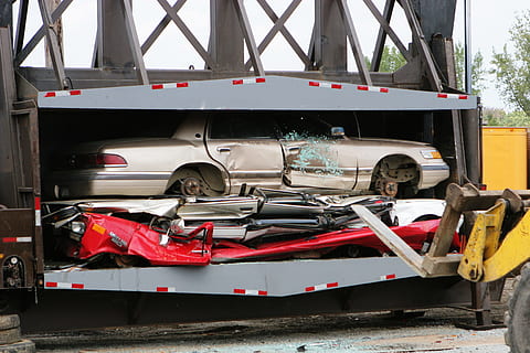 car, compound, crushed, parts, machinery, equipment, compression, damaged, destroyed, transportation, mode of transportation, land vehicle, day, red, truck, outdoors, accidents and disasters, no people, safety, security, protection, fire engine, nature, metal, architecture, rescue, wheel, 2K, CC0, public domain, royalty free