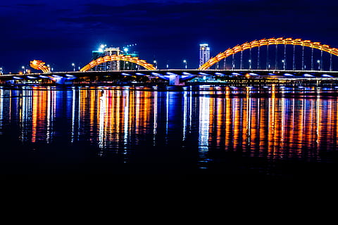 gray bridge, building, lighting, bridge, architecture, arch, arched, night, outdoors, arch bridge, nature, waterfront, water, reflection, asia, longexposure, dragon, danang, vietnam, thailand, urban, built structure, illuminated, city, building exterior, bridge - man made structure, sky, travel destinations, connection, no people, cityscape, transportation, sea, skyscraper, office building exterior, nightlife, 5K, CC0, public domain, royalty free